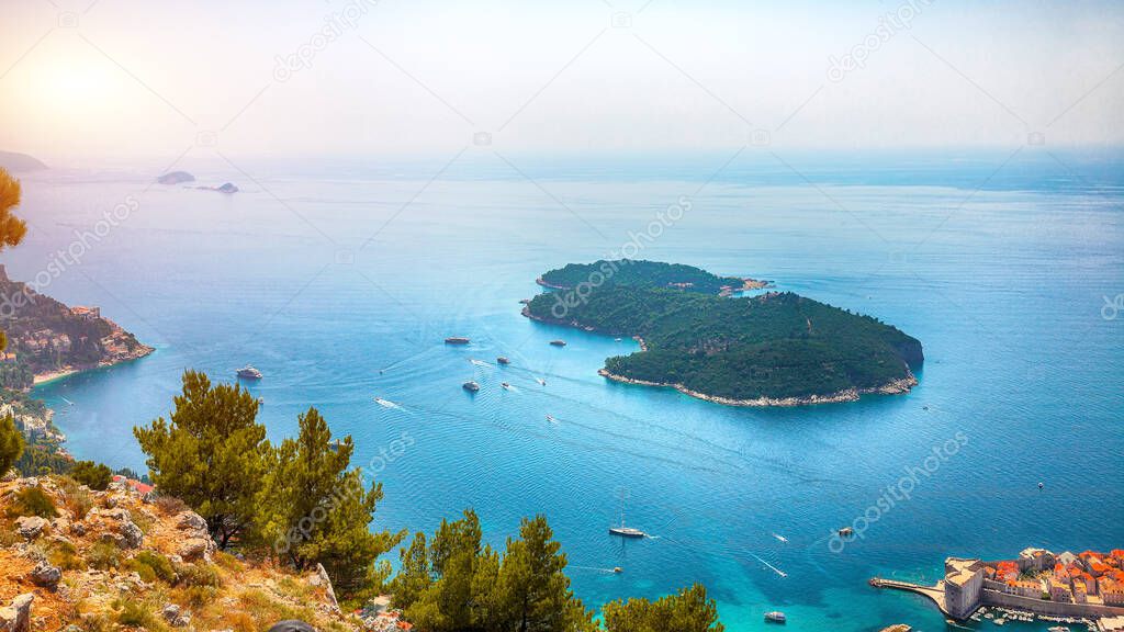 Aerial panoramic view of Lokrum island and Old Town of Dubrovnik on a sunny day. Location:  Dubrovnik, Dalmatia, Croatia, Europe