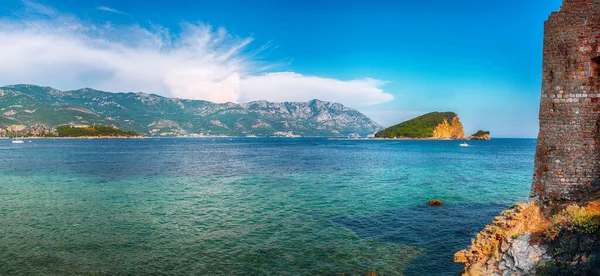 Panoramic summer view of Adriatic sea coast and Budva city. Location: Budva, Montenegro, Balkans, Europe