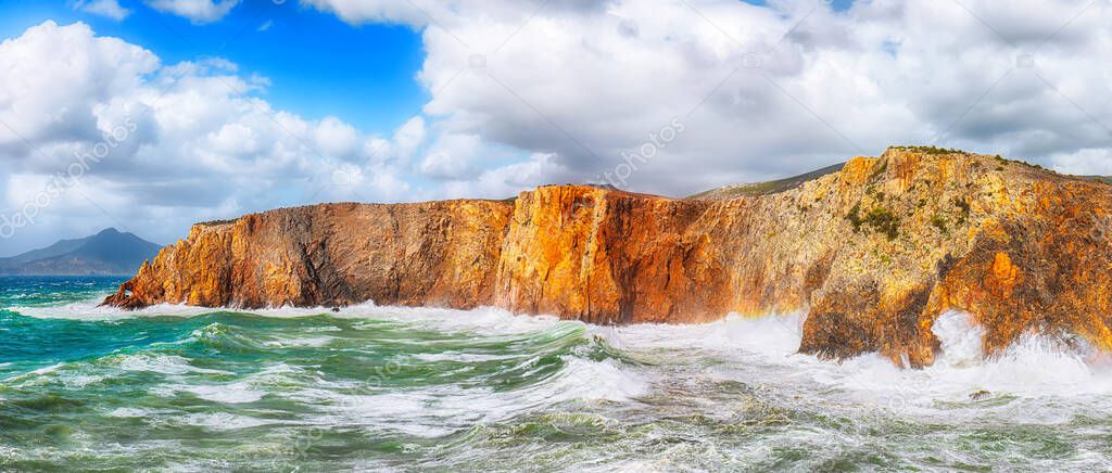 Fantastic view of cliffs in valley Cala Domestica  and storm on the sea.  Location:  Buggerru, South Sardinia, Italy Europe