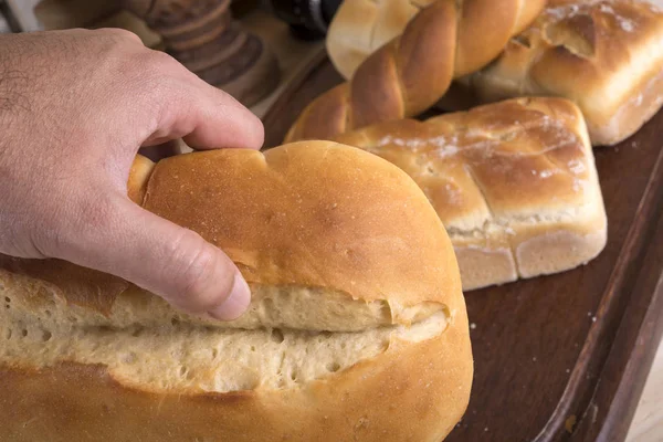 Man's Hand Holding Bread — Stock Photo, Image