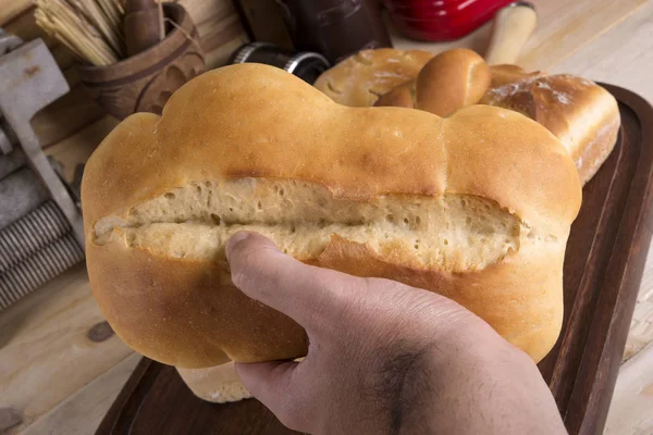 Man's Hand Holding Bread — Stock Photo, Image