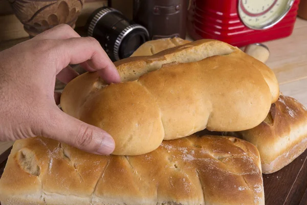 Man's Hand Holding Bread — Stock Photo, Image