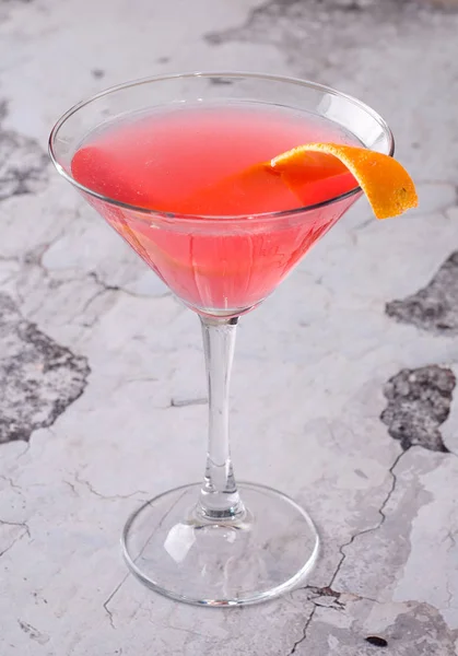 Top view red orange cocktail margareta fresh in a martini glass on a gray background. Bar alcohol drink menu, delicious tequila sunrise long drink for party. — Stock Photo, Image