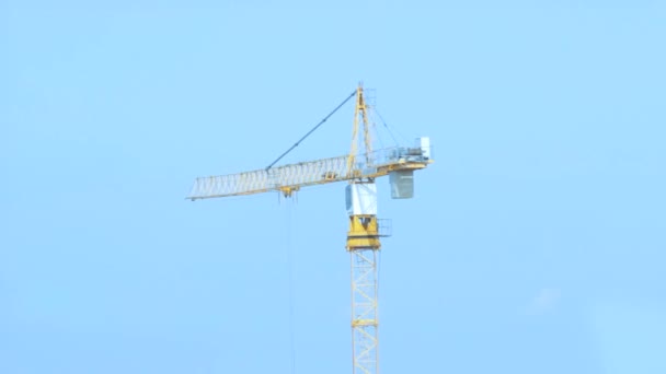 Tower crane working on construction site — Stock Video