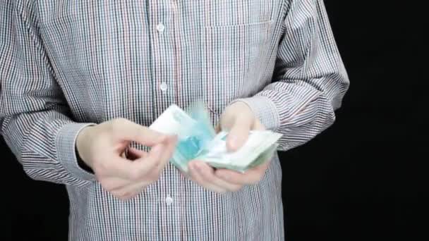 A man counts a big amount of money thoroughly — Stock Video