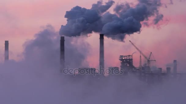 Puff of smoke from the chimneys at sunset — Stock Video