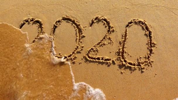 Word 2020 année peinte au sable est lavé par la vague — Video