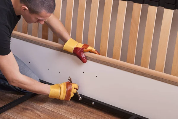 Assembling bed furniture — Stock Photo, Image