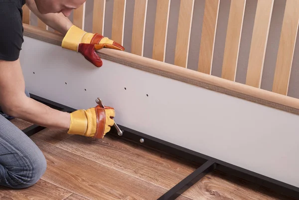 Assembling bed furniture — Stock Photo, Image