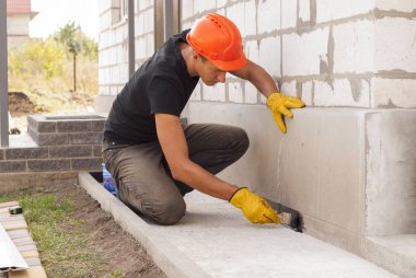 bitumen waterproofing of the foundation clipart