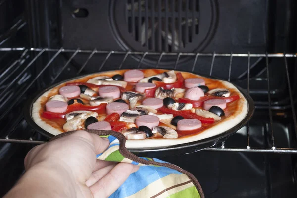 Pizza in the electric oven — Stock Photo, Image