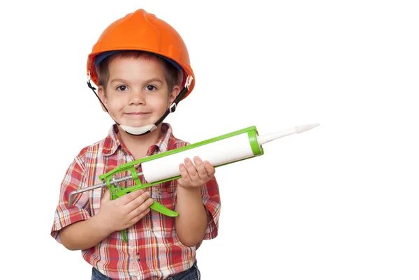 Çocuk inşaat işçisi ve silikon — Stok fotoğraf