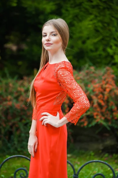 Beautiful girl in short red dress — Stock Photo, Image