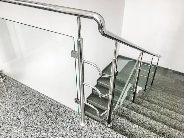 Stainless steel metal rail near stairs