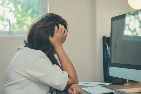 Asia worker woman stressed with modern computer on workspace