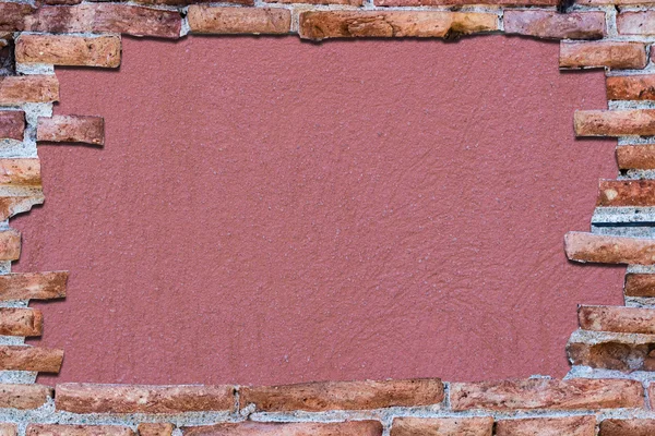 Ancient red brick wall over background Bittersweet shimmer.