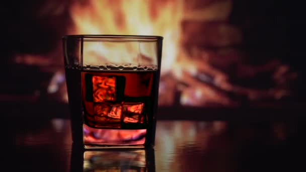 Glass of alcohol near the fireplace — 비디오