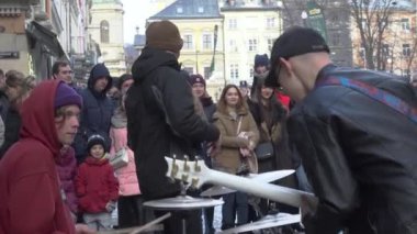 Street musicians play music for people