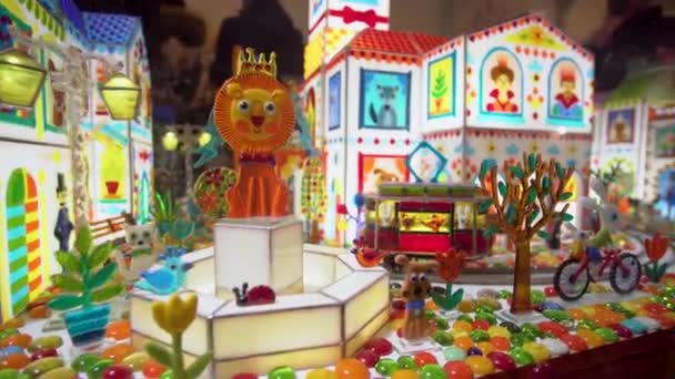 Colorful caramel toys in a shop window — Stok video