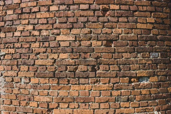 Old orange brick wall contrast texture on cylinder, grunge background