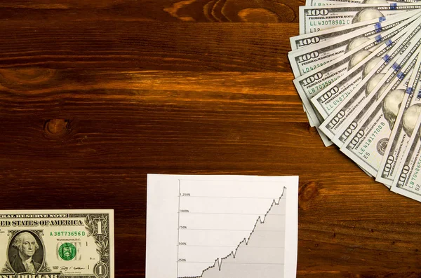 Gráfico de ações e dinheiro de papel para fundo . — Fotografia de Stock