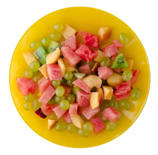 Вегетарианский салат из фруктов на тарелке — стоковое фото