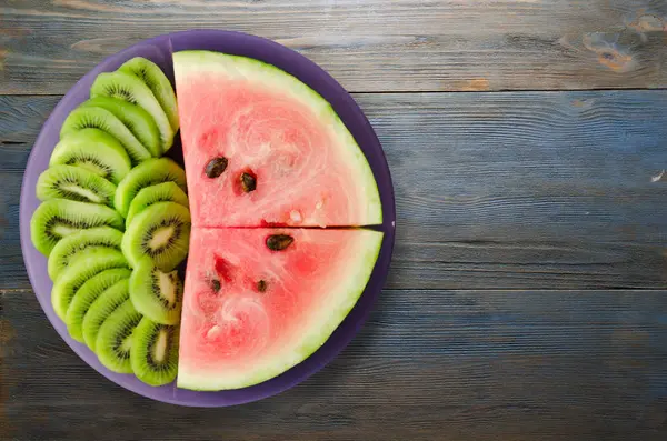 Watermelon and kiwi sliced on a plate — Stock Photo, Image