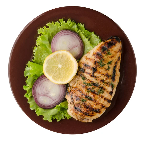 Grilled chicken fillet with vegetables (lemon, salad, onion) is — Stock Photo, Image