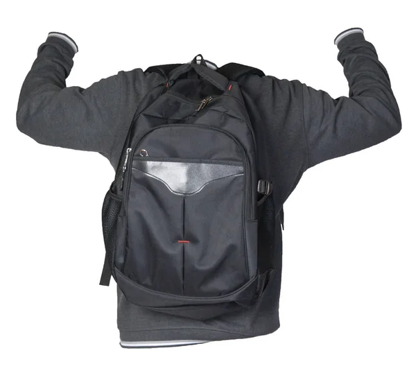 Schwarzer Rucksack bekleidet mit einem Strickpullover auf weißem Grund — Stockfoto