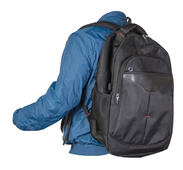 Schwarzer Rucksack bekleidet mit blauer Jacke auf weißem Rücken — Stockfoto