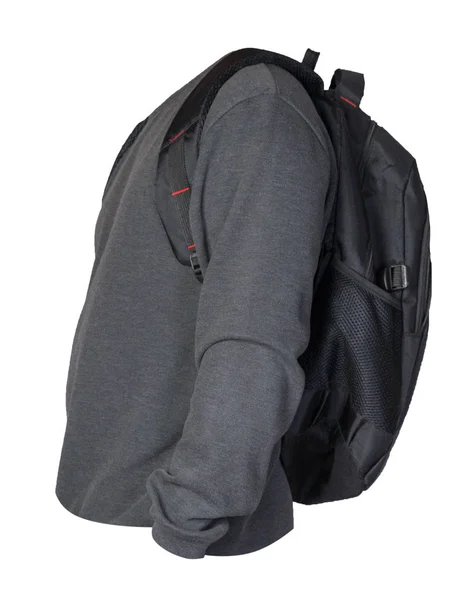 뜨개 질을 한 스웨터를 입은 검은 가방 이 휘슬에 고립되어 있다 — 스톡 사진