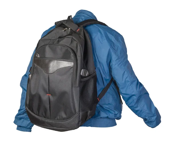 Чорний рюкзак, одягнений у синю куртку, ізольований на білій спині — стокове фото