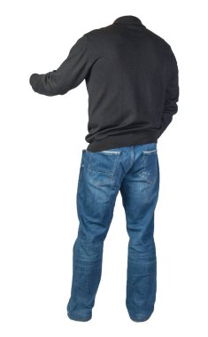 Beyaz arka planda izole edilmiş erkek kazağı ve kot pantolon. Sıradan pıhtı.