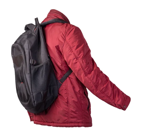 Schwarzer Rucksack mit roter Jacke auf weißem Hintergrund. — Stockfoto