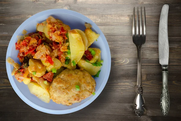 Cutlets Potatoes Stewed Tomatoes Cutlet Light Blue Plate Fork Knife — Stock Photo, Image