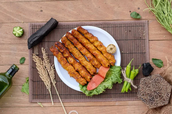 Stock photo of halal chicken mutton beef kebab,  tikka, boti on plate top view