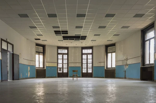 Internal room of old and abandoned devastated school, ready for renovation