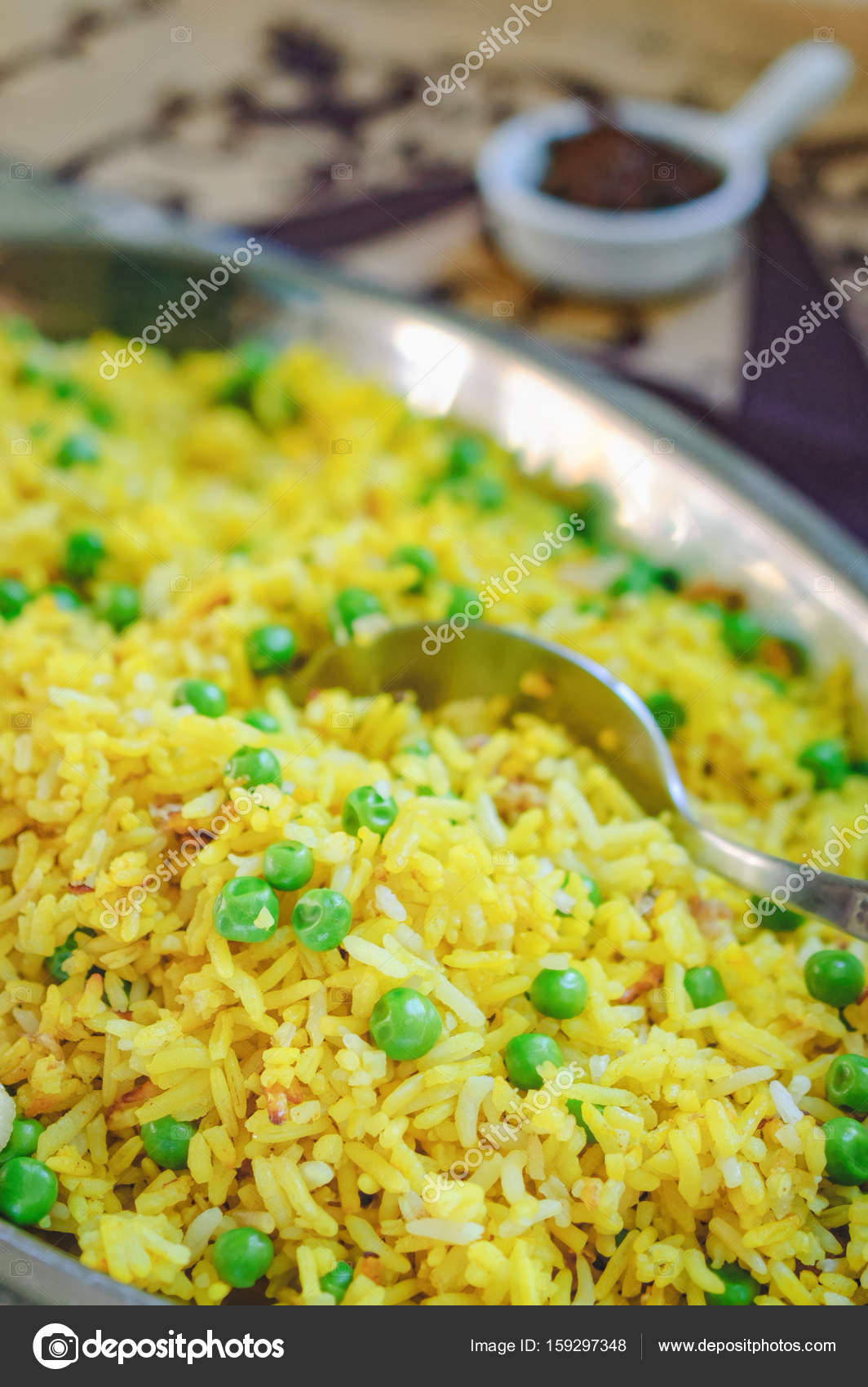 Fragrant yellow fried rice with green peas. — Stock Photo © sonatali