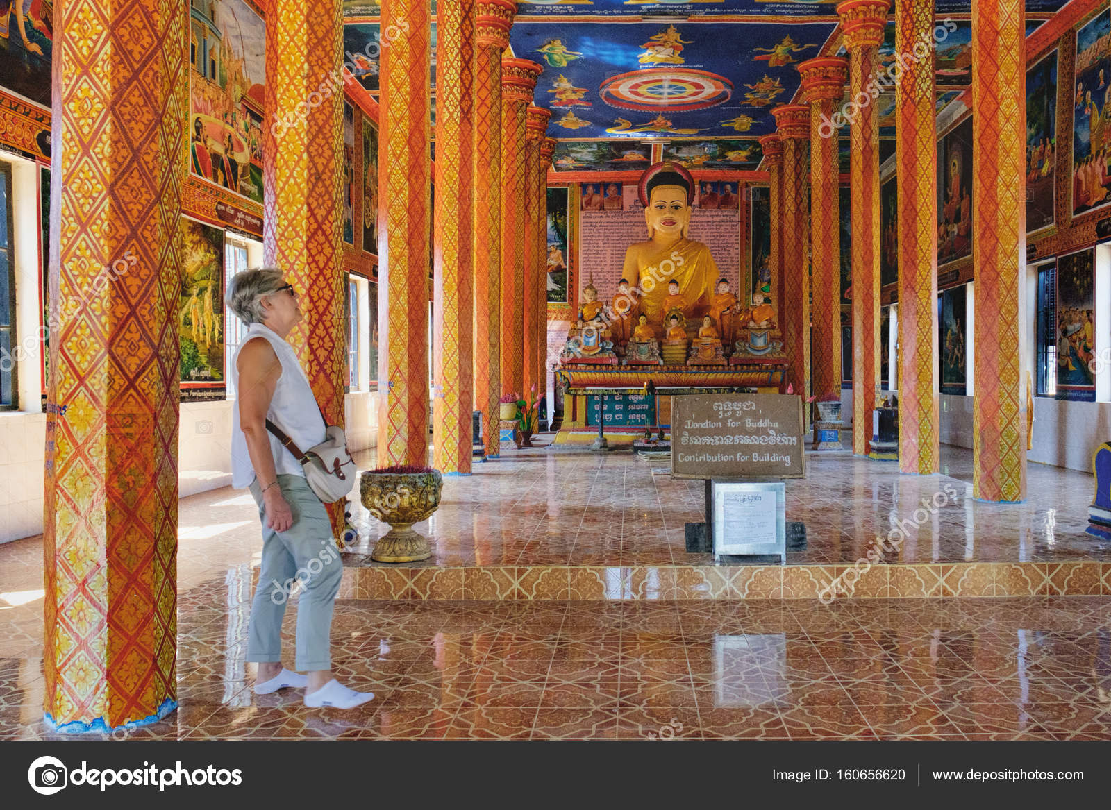 Tourists visit to Theravada Buddhist monastery Stock Editorial Photo