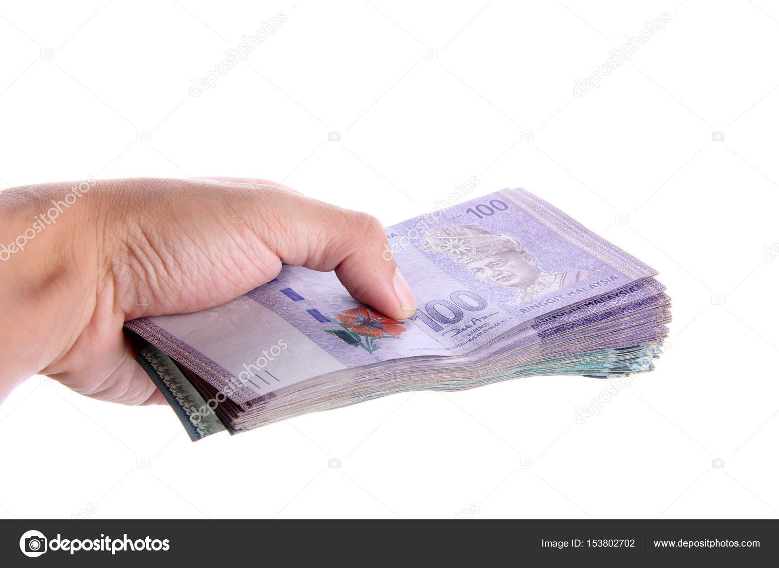 A hand giving a stack of Malaysian Ringgit — Stock Photo