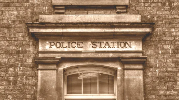 Comisaría tallada en piedra Letras mayúsculas Vintage Sepia —  Fotos de Stock