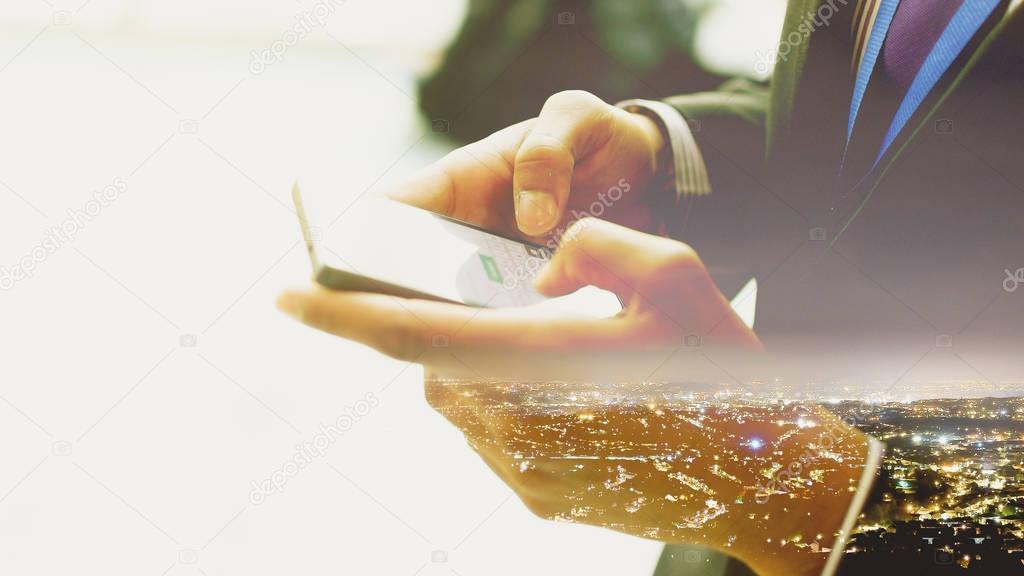 Double Exposure of a man using Smartphone