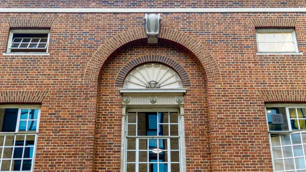 Rounded Vintage Windows on the Red Brick Wall