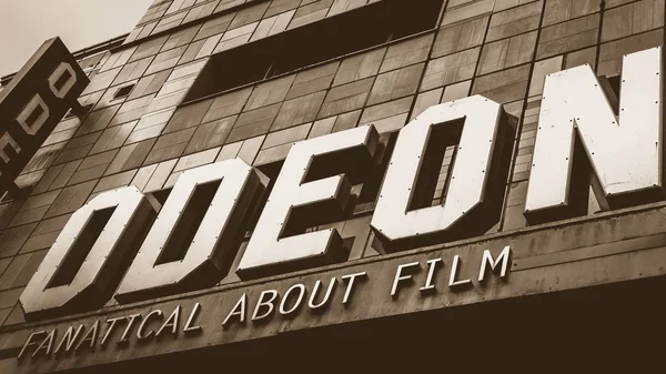 Odeon Cinema wall name sign low angle — Stock Photo, Image