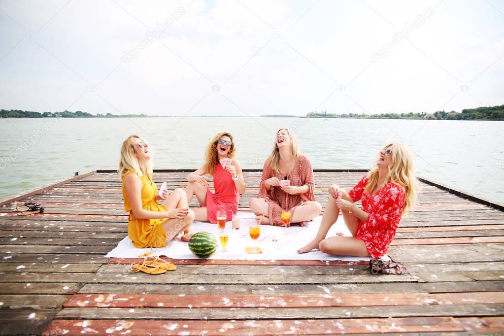 Best girl friends having fun at lake