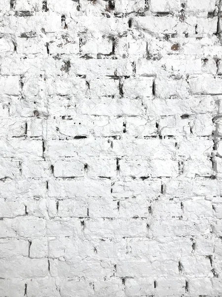 Textura enferrujada de parede de tijolo pintada de branco. Detalhe e decoração . — Fotografia de Stock