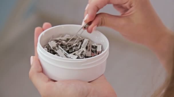 Close up shot. Woman holding case with barrettes — Stock Video