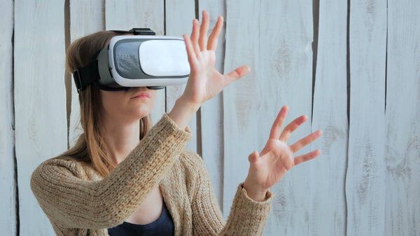 Young woman using Virtual Reality Glasses