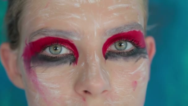 Close up shot of teen girls eyes with creative unusual makeup — Stock Video