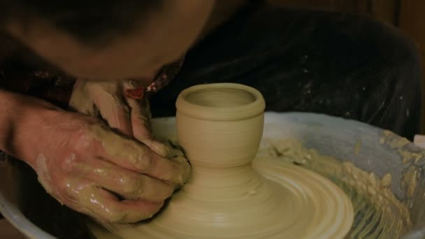 Professional potter shaping mug with special tool in pottery workshop — Stock Video